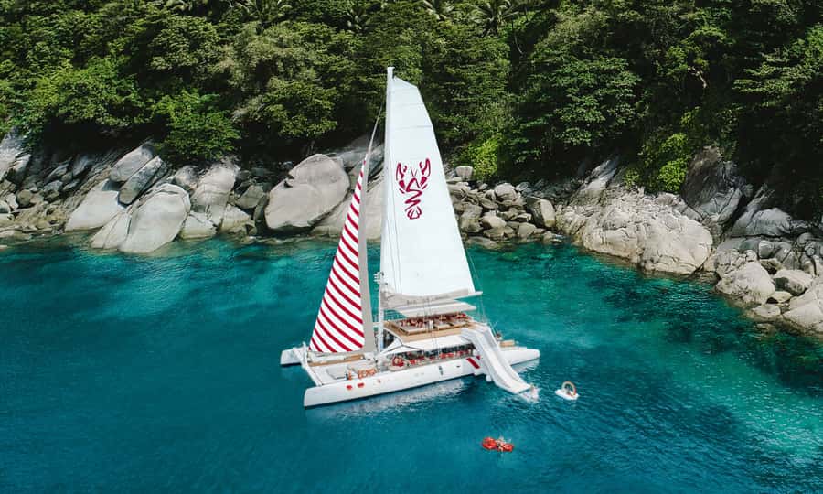 Phuket: Sailing Yacht Island Hopping & Party Full-Day Cruise - Banana Beach: An Easy Start on Coral Island