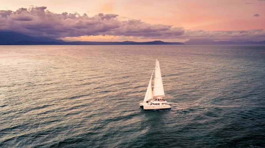 Port Douglas: Sunset Sailing Cruise on Luxury Catamaran - Booking flexibility and what to bring