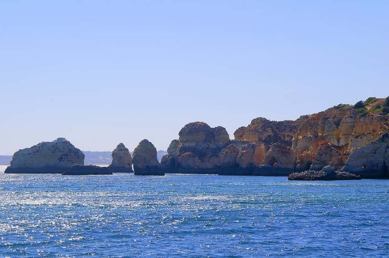 Portimão: Boat Trip by Sailing Boat to Lagos Cape Caves - Lagos harbor, the castle, and old waterfront sights