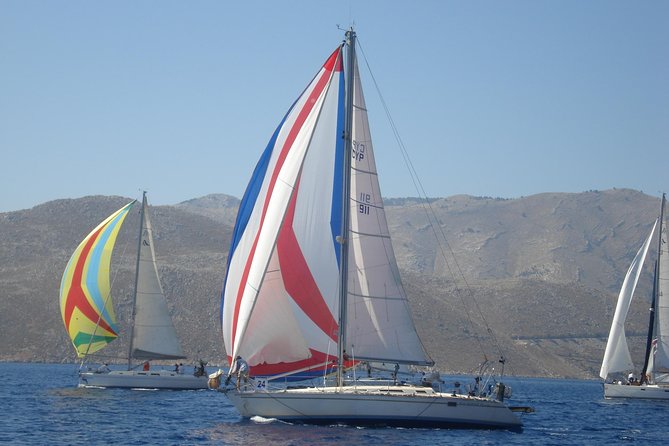 Private cruise with a sailing yacht Koursaros - Trying the helm with the skipper nearby
