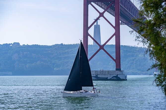 Private sailboat tour in Lisbon - Seeing Cristo Rei from the south bank