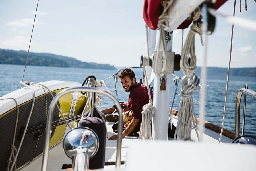 Sail Bainbridge Island & Seattle Waters - Classic Sailboat - Taking the wheel with Captain Ben