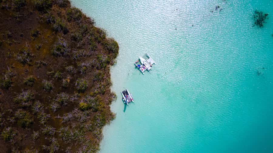 Sail for 4 hours in the most SECRET spot in Bacalar. INCLUDES Beach Club. - What the $196 private price really means