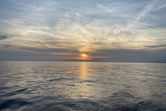 Sailing at sunset along the cliffs of Maro-Compartida - Key points to know before booking