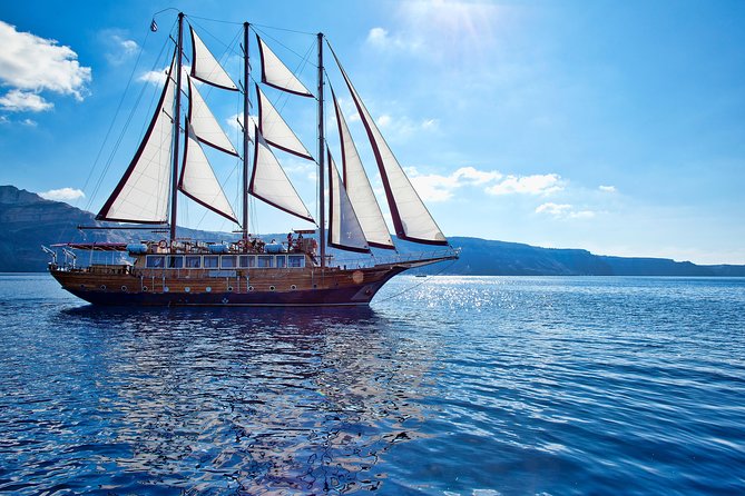 Santorini Caldera Sunset Sailing Cruise with Dinner and Wine - Sunset near Oia, viewed from the water