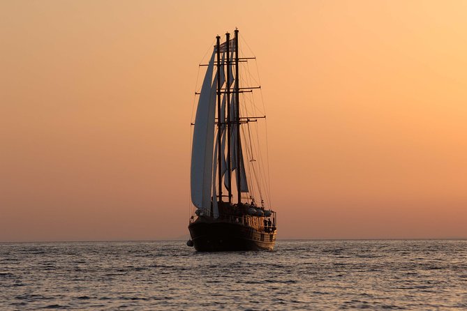 Santorini Caldera Sunset Sailing Cruise with Dinner and Wine - The boat atmosphere: friendly, lively, and not private