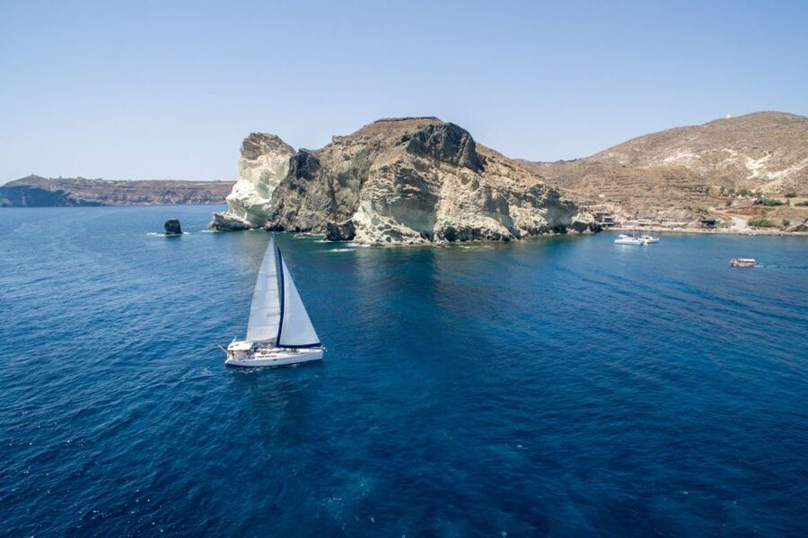 Santorini Caldera: Sunset Sailing Cruise with Meal - Red Beach and White Beach from the sea