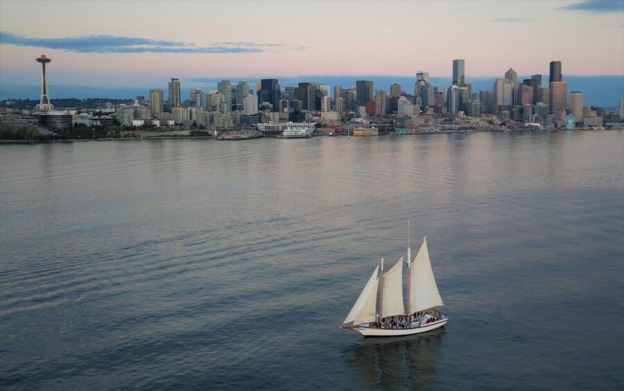 Seattle: Tall Sailboat Sunset Harbor Cruise - Raising sails and taking the wheel
