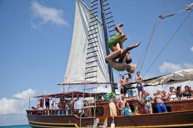 Set Sail in Aruba: Jolly Pirate Cruise with Snorkel Adventure - Boarding the 85-foot schooner at MooMba Beach