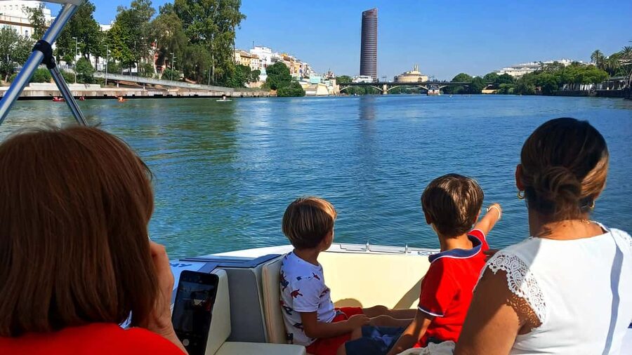 Seville: Sail the River. 100% private - Torre del Oro and Plaza de Toros from the river