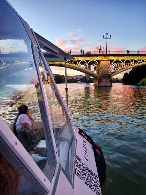 Seville: Sail the River. 100% private - Meeting beneath the Puente de Triana