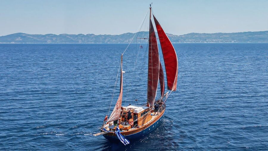 Skiathos: Wooden Sailboat Full- or Half-Day Trip with Meal - A meal, music, and a slow day at sea