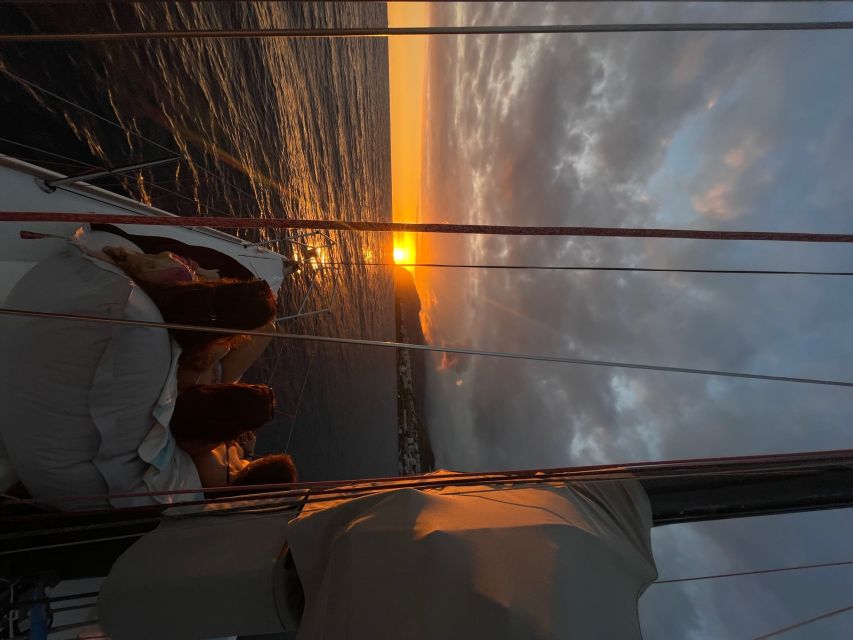 Sunset on a sailing boat - Swimming below Cabo Girão