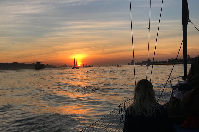 Sunset sailboat tour in Lisbon with green wine - Under the bridge beside the pillars