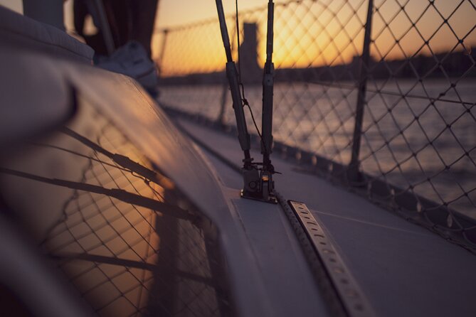 Sunset sailboat tour in Lisbon with green wine - Wine, snacks, music, and a comfortable deck