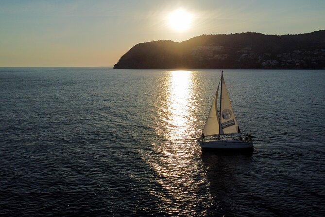 Sunset sailing along the cliffs of Maro- Private - A Bavaria 37 With Space for Your Group