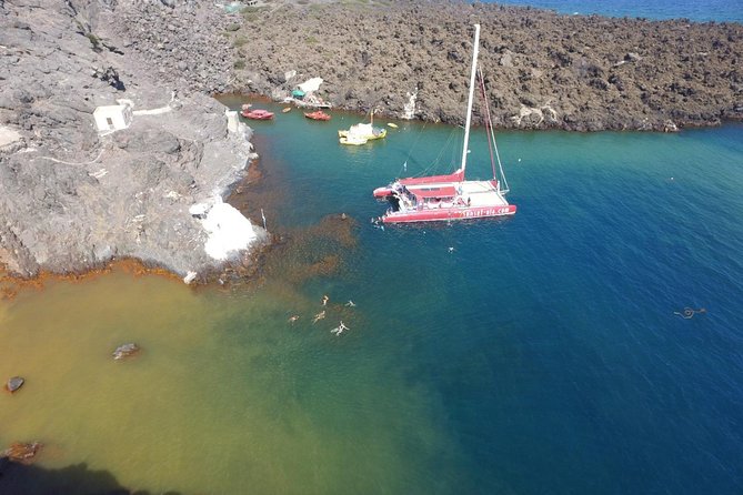 Sunset Sailing Catamaran Cruise in Santorini with BBQ and Drinks - White Beach brings the BBQ and the longest stop