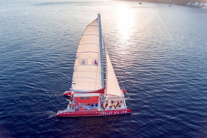 Sunset Sailing Catamaran Cruise in Santorini with BBQ and Drinks - The sunset is beautiful, but the exact viewpoint can change